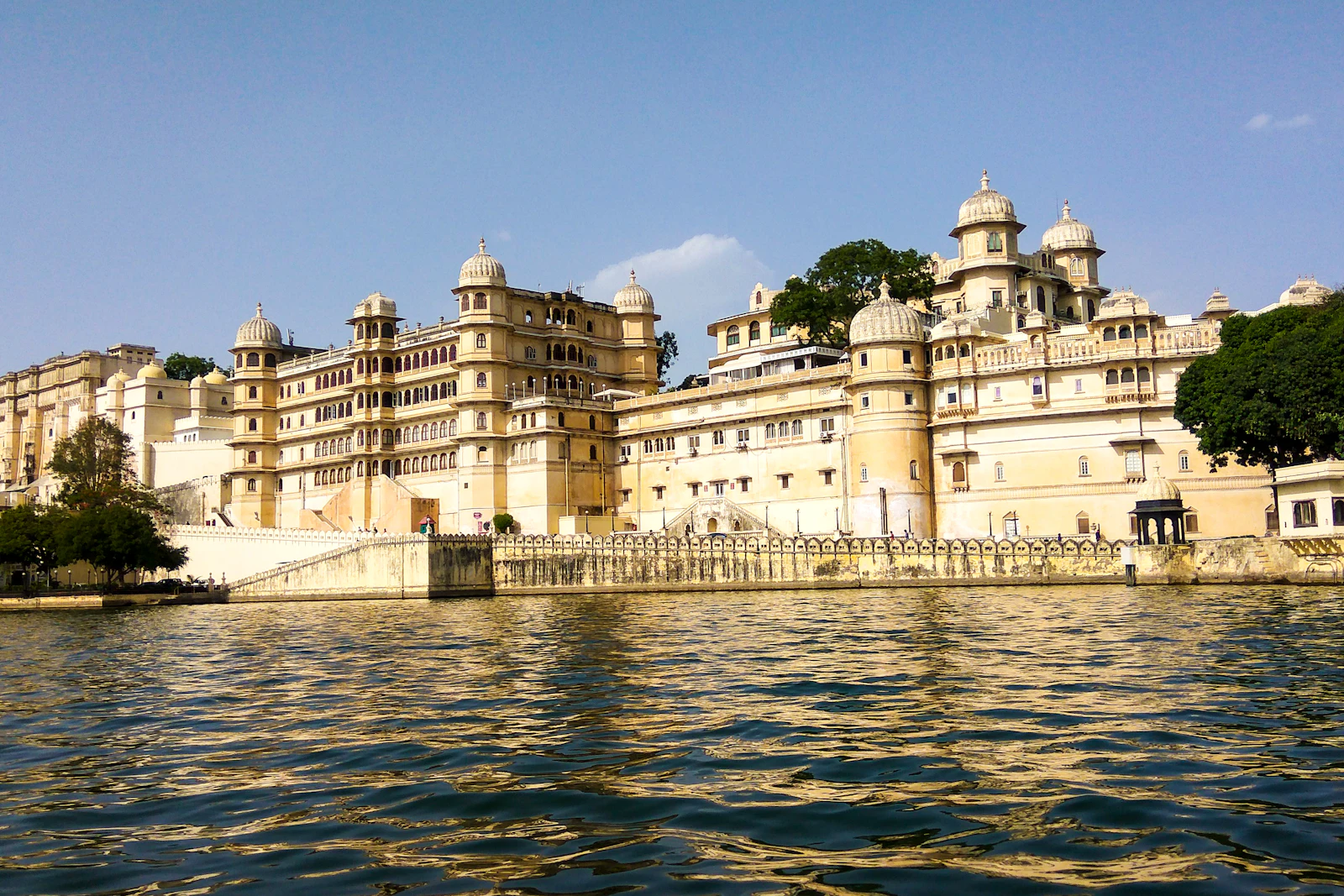The City Palace of Udaipur rising above Lake Pichola, seen from the water
